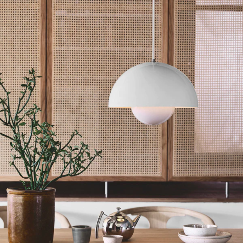 The Flowerpot VP2 Pendant Light by Verner Panton became synonymous with the Flower Power movement from the late 60s. Reflecting a break from convention to embrace a more open, modern mentality that promoted peace and harmony. Such was the mindset of its designer, Verner Panton. One of the most forward-thinking talents of his time. The Flowerpot series consists of several different models, including three pendants and two table lamps - all in a wide range of colors.