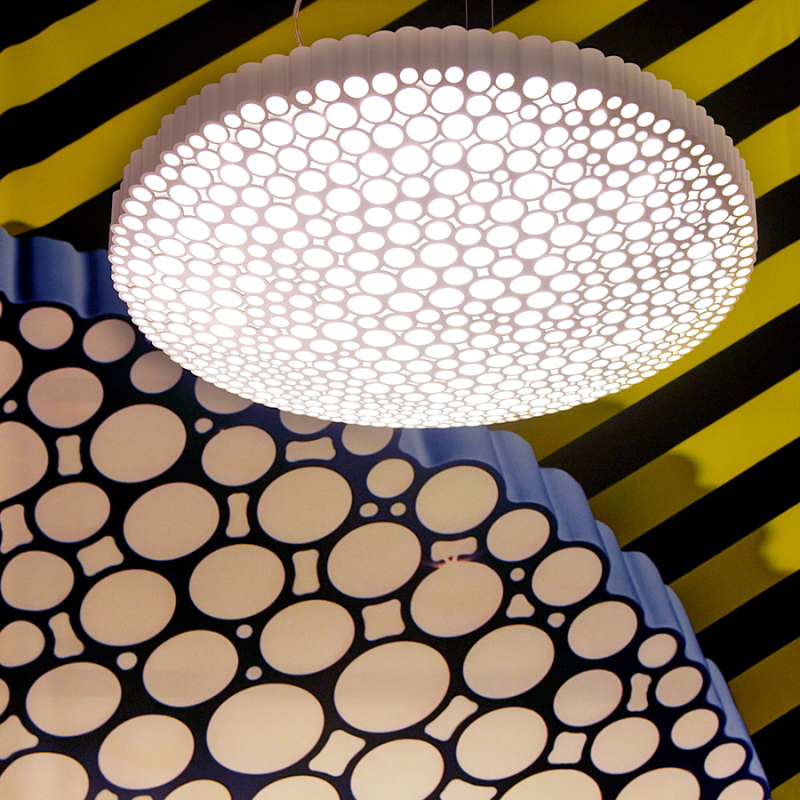This is the Calipso Suspension pendant light from Artemide in a display.