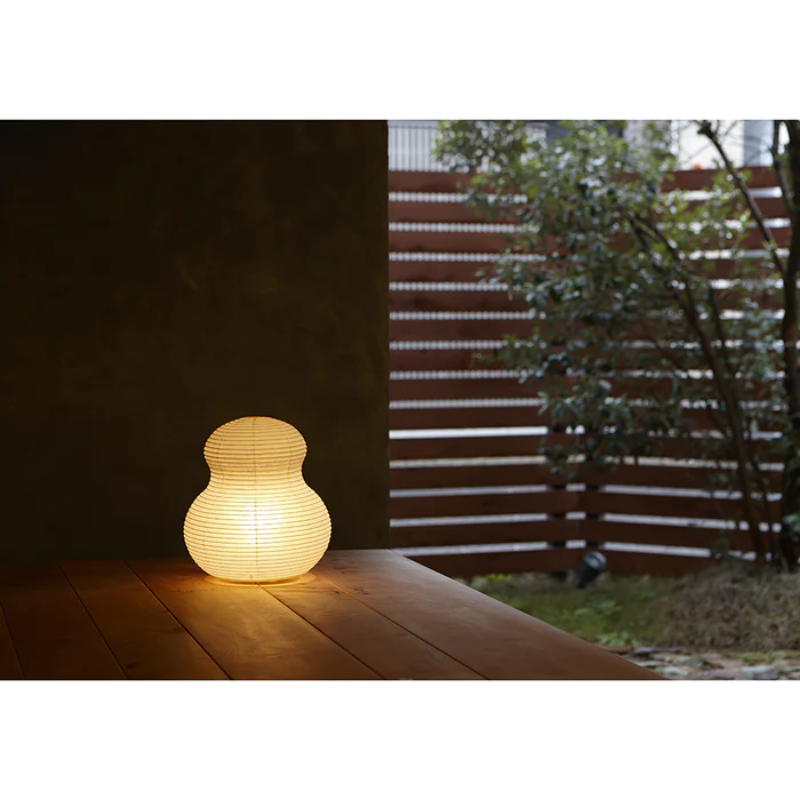The Paper Moon 2 from Asano turned on while outdoors on a porch.