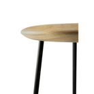 The Baretto Bar Stool from Ethnicraft in a detailed close up shot of the wooden seat.