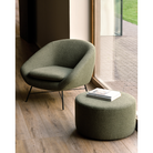 The Barrow Lounge Chair from Ethnicraft in a lifestyle shot with the Barrow Pouf from the Barrow collection.