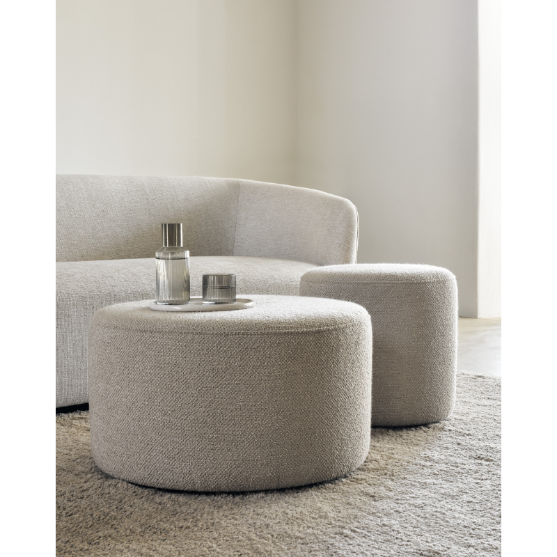 The Barrow Pouf by Ethnicraft being used in a lounge.