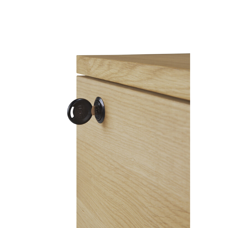 The Billy Drawer Unit from Ethnicraft in oak with the key in the top drawer which can be locked.