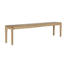 The Bok Bench from Ethnicraft in the oak finish and 73 inch length from a side angle.