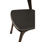 The Bok Dining Chair from Ethnicraft in brown oak with brown leather upholstery.