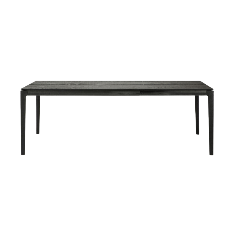 The Bok Extendable Dining Table from Ethnicraft in black oak which extends from 55 to 87 inches.