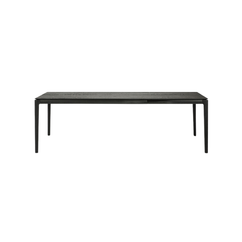 The Bok Extendable Dining Table from Ethnicraft in black oak which extends from 63 to 96 inches.