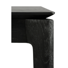 The corner of the Bok Extendable Dining Table from Ethnicraft in black oak.