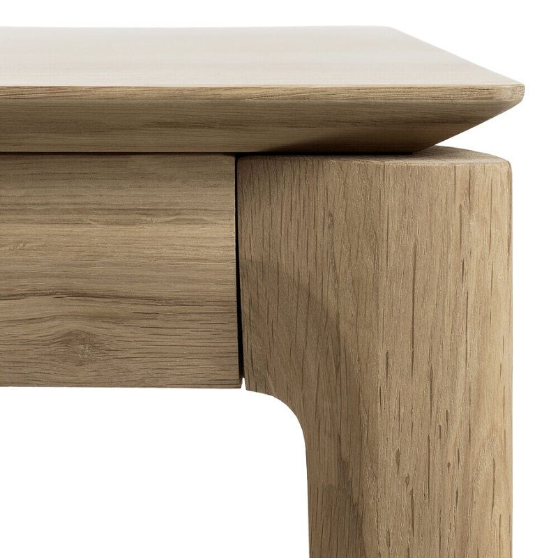 The corner of the Bok Extendable Dining Table from Ethnicraft in oak.
