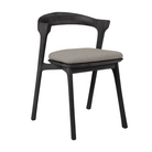The Bok Outdoor Dining Chair from Ethnicraft in black teak with a cushion in mocha color.