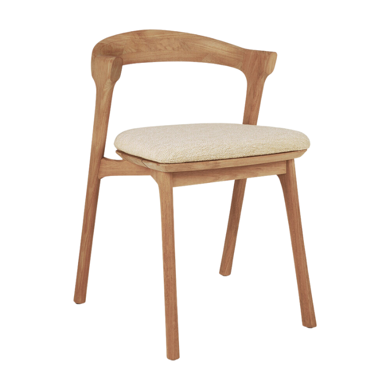 The Bok Outdoor Dining Chair from Ethnicraft in teak with a cushion in natural color.