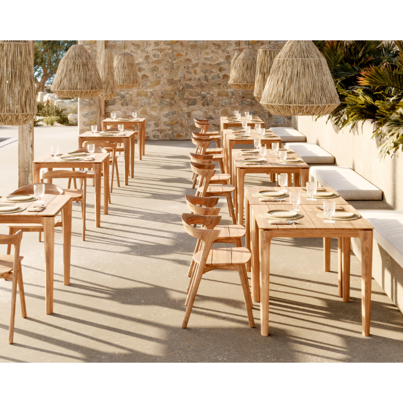 The Bok Outdoor Dining Table from Ethnicraft in a restaurant.