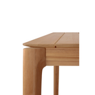 The Bok Outdoor Dining Table from Ethnicraft in solid teak, with a close up on the corner.
