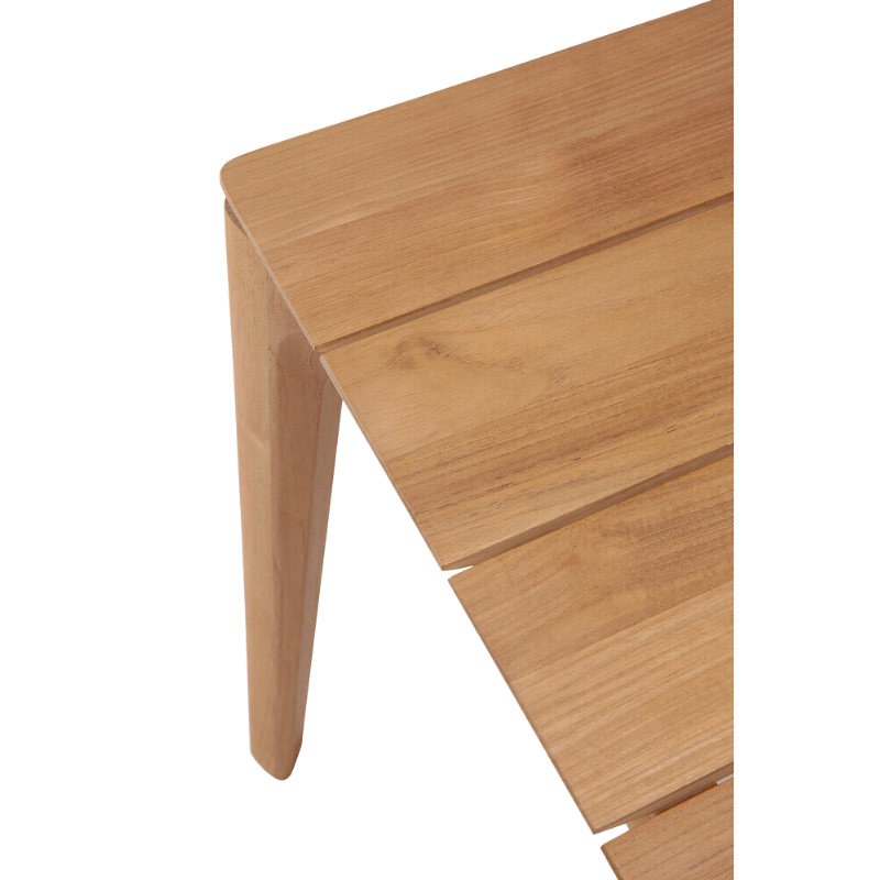 The Bok Outdoor Dining Table from Ethnicraft in solid teak, with a close up on the table top.