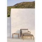 The Boucle Rectangular Outdoor Cushion from Ethnicraft in an outdoor lounge.