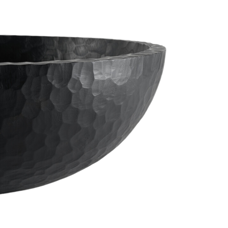 The Chopped XL Bowl from Ethnicraft in a photograph highlighting the texture of the solid wood bowl.