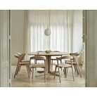 The Corto Dining Table from Ethnicraft in a dining room.