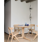The Corto Dining Table from Ethnicraft in a dining space.