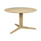 The round Corto Dining Table from Ethnicraft in oak.