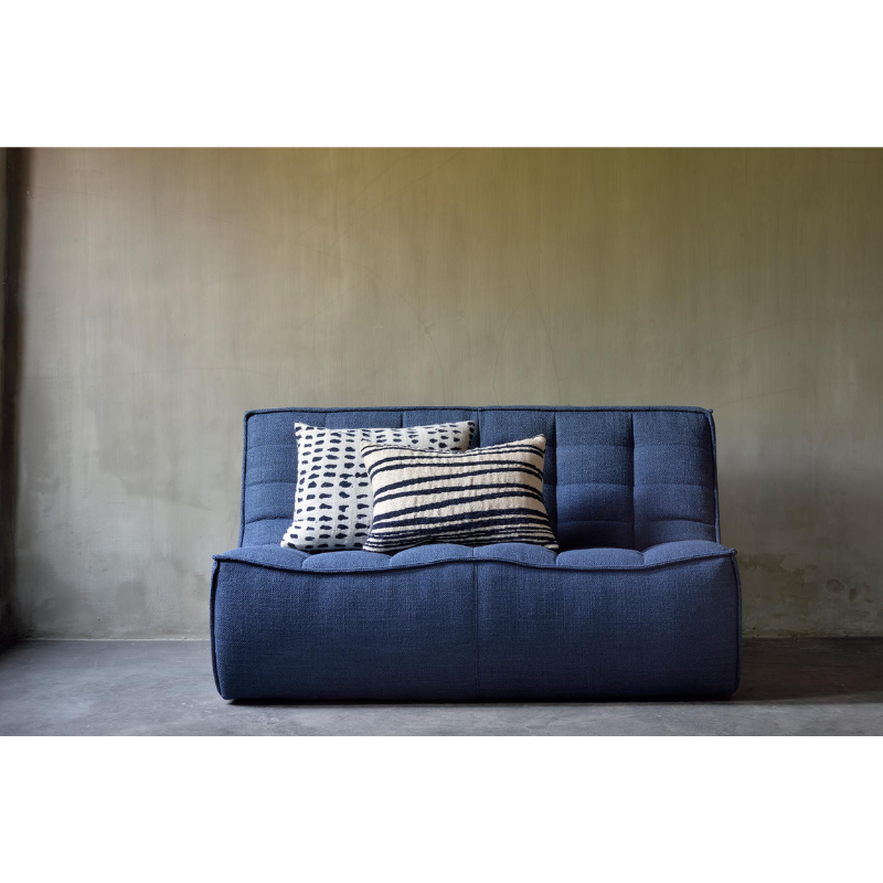The Dots Cushion from Ethnicraft in a living room lifestyle photograph.
