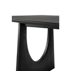The Geometric Dining Table from Ethnicraft in solid oak tainted black.