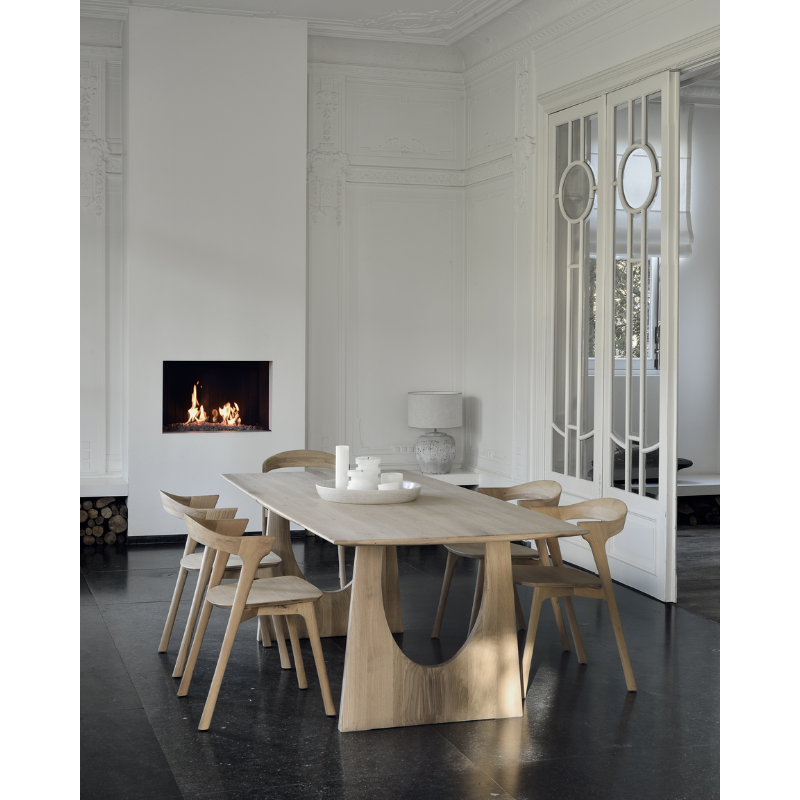 The Geometric Dining Table from Ethnicraft in a dining room.