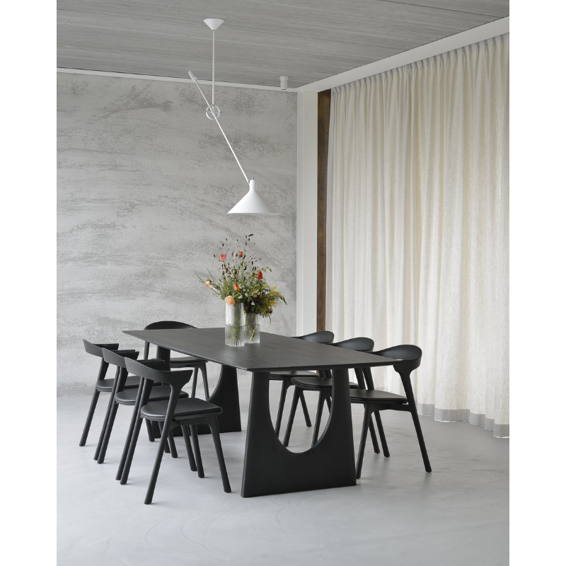 The Geometric Dining Table from Ethnicraft in a living room.