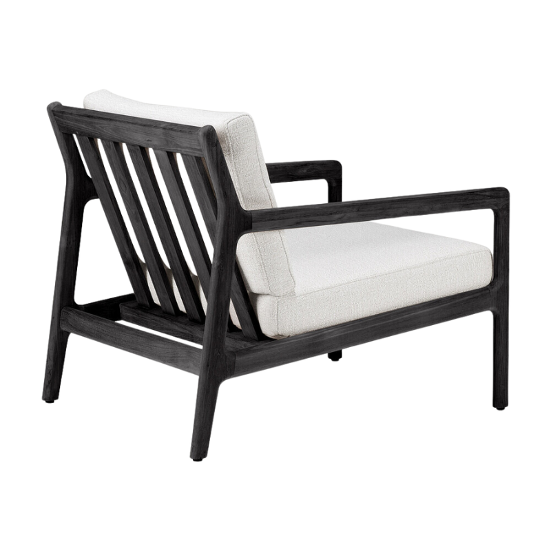 The Jack Outdoor Lounge Chair from Ethnicraft made from solid teak tainted and brushed black with the off white cushion.
