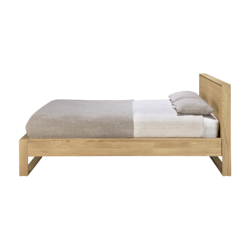 The Nordic II Bed from Ethnicraft in a side shot of the bed frame.