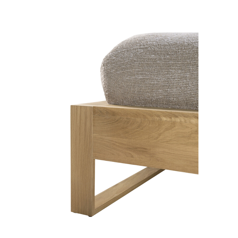 The Nordic II Bed from Ethnicraft in a photograph showing the texture of the solid wood furniture piece.