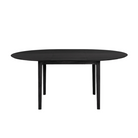 The Round Bok Extendable Dining Table from Ethnicraft in solid oak, tainted black.