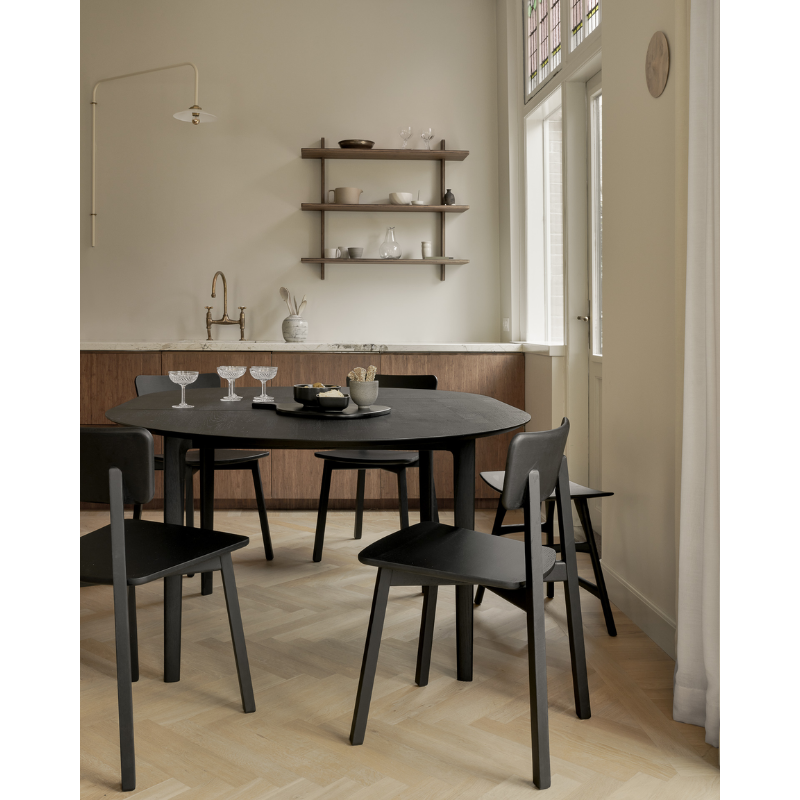 The Round Bok Extendable Dining Table from Ethnicraft in a kitchen.