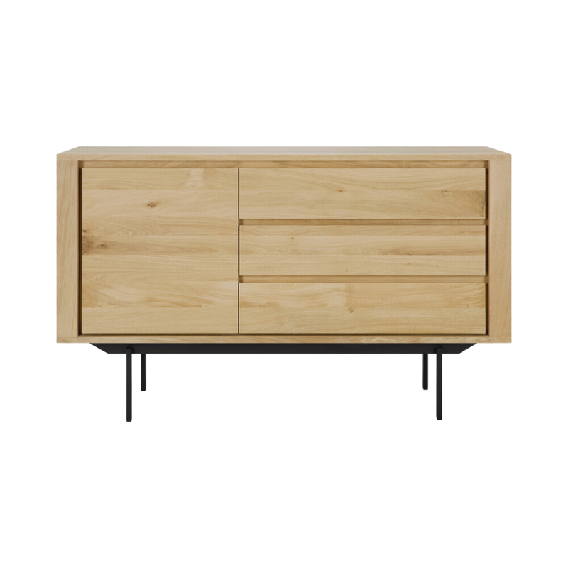 The Shadow sideboard is straightforward and robust with decisive lines. This more recent design with black metal legs, giving the design room to breathe, elevates this sideboard to new heights.