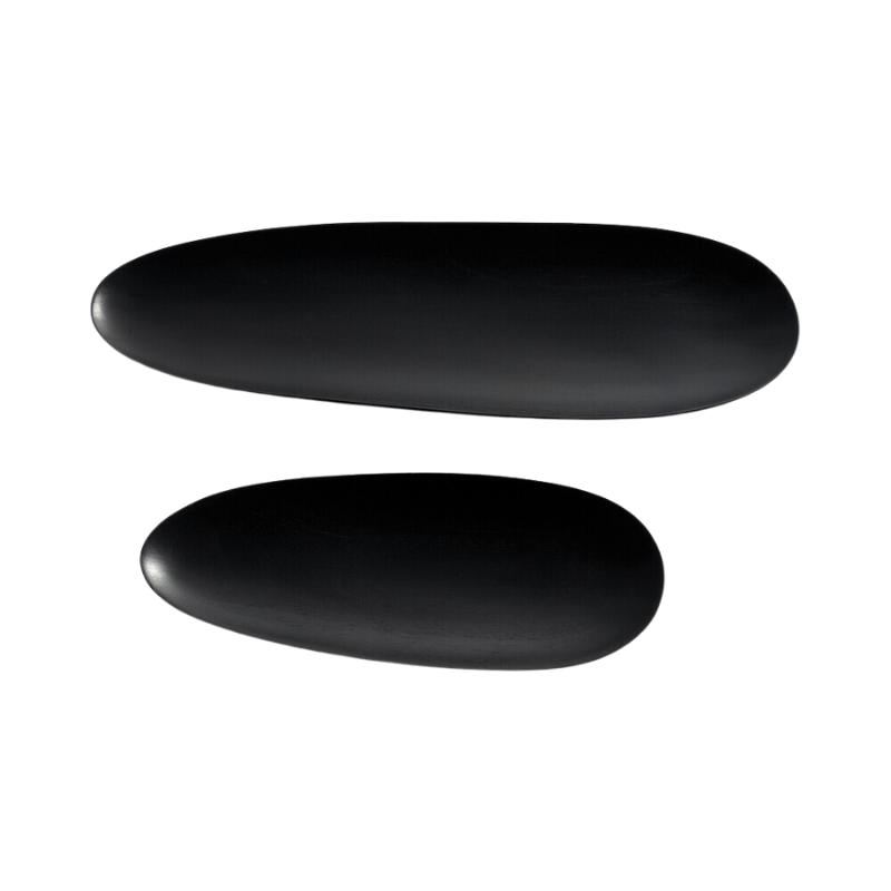 The Thin Oval Boards Set from Ethnicraft in black mahogany in a studio shot.