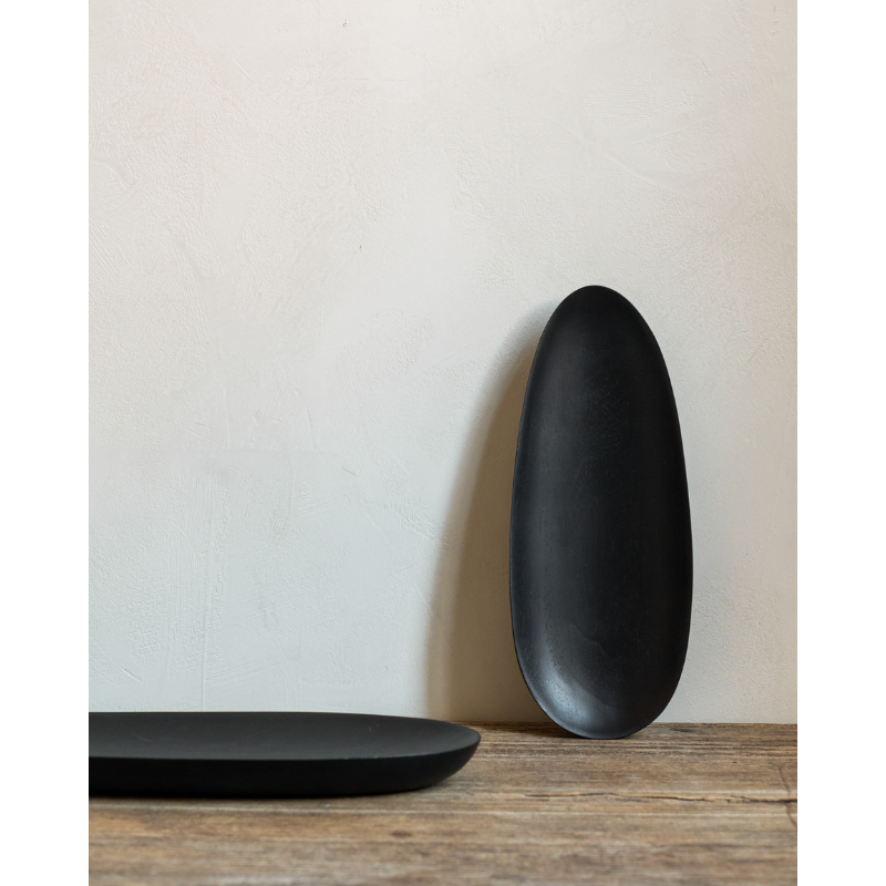 The Thin Oval Boards Set from Ethnicraft in a lounge.