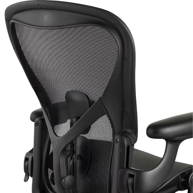 The Aeron Chair from Herman Miller with adjustable posturefit SL back support in black and onyx ultra matte focusing on the back support.