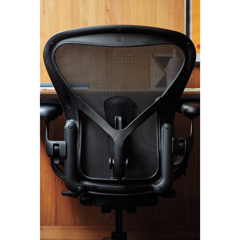 The Aeron Chair from Herman Miller in a close up lifestyle photograph.