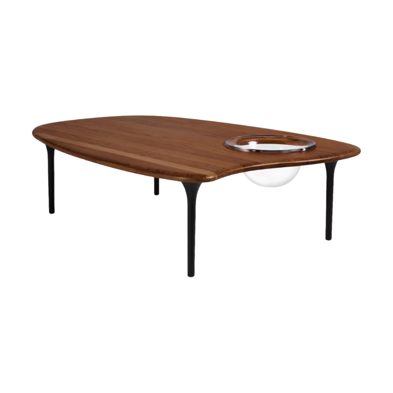 The Cyclade Table from Herman Miller in low, with a bowl, in walnut.