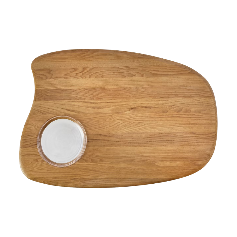The Cyclade Table from Herman Miller in low, with a bowl, in white oak.