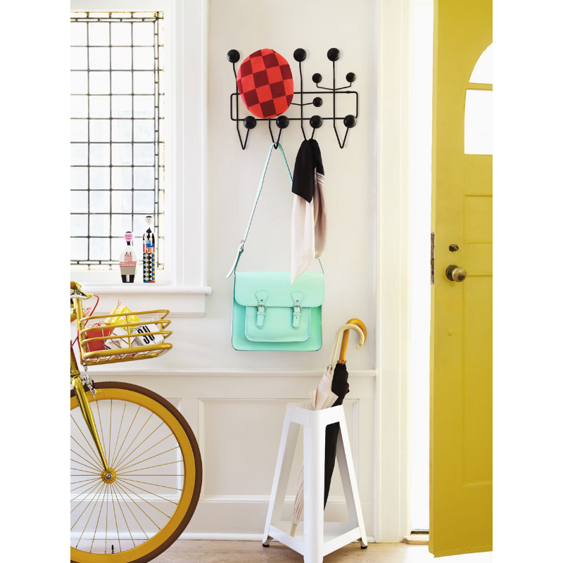 The Eames Hang-It-All from Herman Miller next to a doorway.
