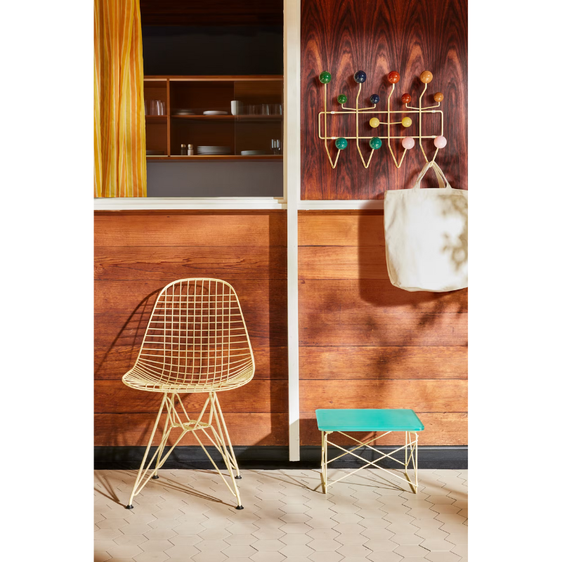 The Eames Hang-It-All rack from Herman Miller, designed by Herman Miller x Hay in a lifestyle photograph withe other Eames collection products.