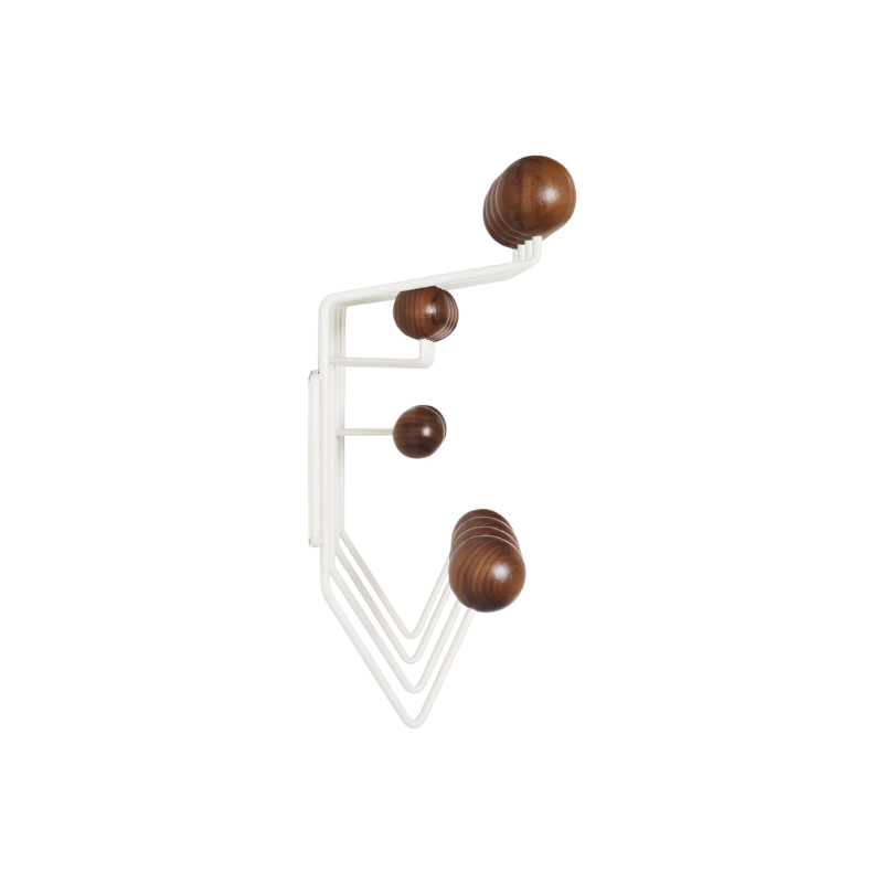 The Eames Hang-It-All, originally released in 1953, exemplifies the Eameses' belief in taking pleasure seriously. Made with a sturdy steel frame and solid wood balls, this colorful coat rack was created using the same technique for simultaneously welding wires that Charles and Ray developed for their low tables and wire chairs.