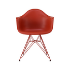The Eames Molded Plastic Armchair by Herman Miller x HAY in iron red.