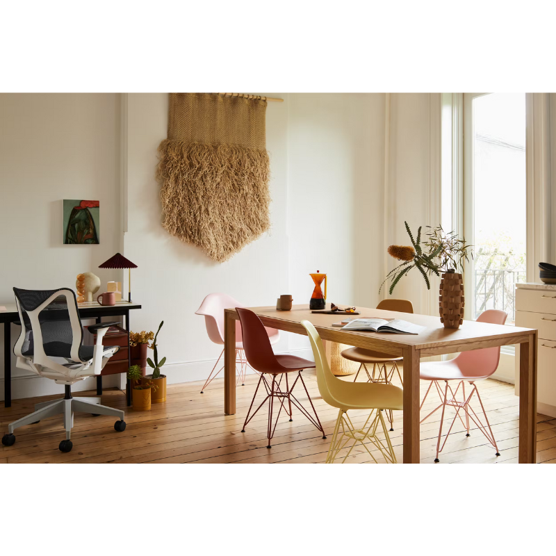 The Eames Molded Plastic Side Chair from Herman Miller designed by Herman Miller x HAY in a lounge area.