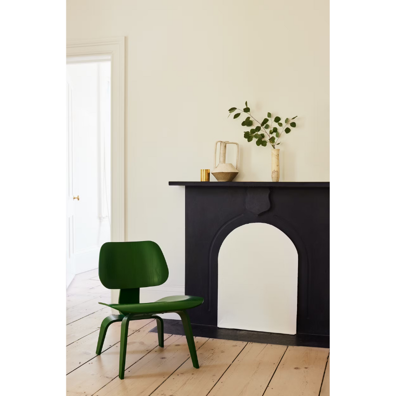 The Eames Molded Plywood Lounge Chair by Herman Miller, designed by Herman Miller x HAY in a living room lifestyle photograph.