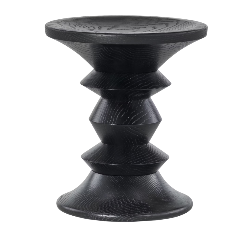 The Eames Turned Stool from Herman Miller made of ebony in shape C.
