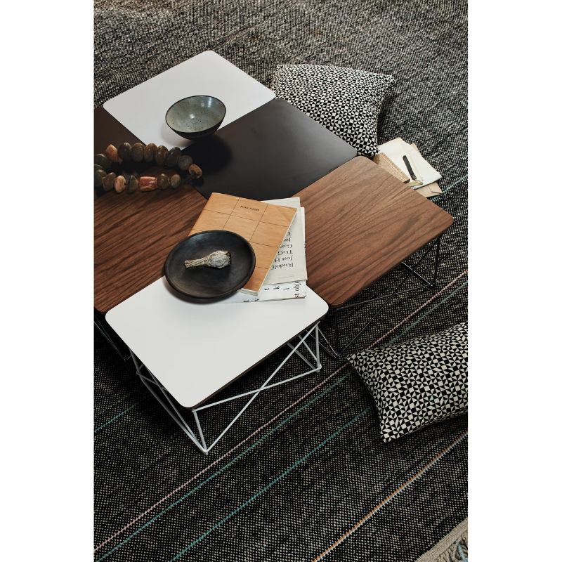 The Eames Wire Base Low Table from Herman Miller in a lounge lifestyle photograph.