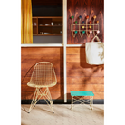 The Eames Wire Chair from Herman Miller, designed by Herman Miller x HAY outdoors with the low table.