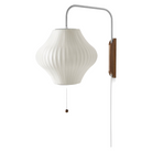 The Nelson® Pear Wall Sconce, a pear-shaped shade hung from a walnut wall mount, will warm any interior with soft, diffused light. A swivel hinge allows for adjustment from left to right and up and down. Timeless Nelson® Bubble Lamps were designed in 1952. This is the authentic Bubble Lamp by Herman Miller, produced along with the George Nelson Foundation.