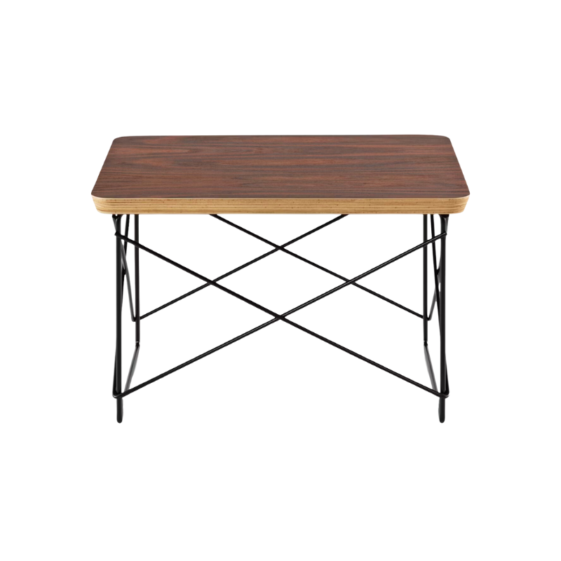 Just 10 inches high, the Eames Wire Base Low Table (1950) provides a handy surface for books or a bedside lamp. The beveled edges of the top of this Eames side table reveal seven layers of sturdy birch plywood. Portable and lightweight, these low wire base tables can be stacked for storage or grouped to form a larger surface. This is the authentic Wire Base Low Table produced by Herman Miller. Eames is a licensed trademark of Herman Miller.